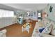 Bright living area featuring hardwood floors, views to dining, and an open layout at 600 N Boundary Ave # 114B, Deland, FL 32720
