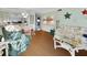 Open-concept living area with hardwood floors and a seamless view to the dining and kitchen area at 600 N Boundary Ave # 114B, Deland, FL 32720