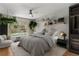 Digitally staged bedroom with modern décor, large bed, and backyard pool view at 6150 Half Moon Dr, Port Orange, FL 32127