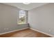 Bedroom with wood floor, bright lighting and large window with backyard view at 6150 Half Moon Dr, Port Orange, FL 32127