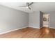 Spacious bedroom with hardwood floors and access to an en-suite bathroom at 6150 Half Moon Dr, Port Orange, FL 32127