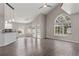 Open concept living room with stylish flooring, plenty of natural light, and views of the backyard pool at 6150 Half Moon Dr, Port Orange, FL 32127