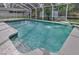 Pool featuring clear blue water, patio, lush landscaping, and a pool fountain at 6150 Half Moon Dr, Port Orange, FL 32127
