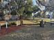 Entrance to Spruce Creek Recreational Facility with sign along the paved road at 6150 Half Moon Dr, Port Orange, FL 32127