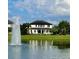 Beautiful backyard view of a lake and fountain at 6301 Swanson St, Windermere, FL 34786