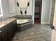 Luxurious bathroom with a soaking tub, walk-in closet, and elegant vanity at 6301 Swanson St, Windermere, FL 34786