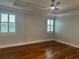 Bedroom featuring hardwood floors, recessed lighting, and windows with plantation shutters at 6301 Swanson St, Windermere, FL 34786