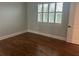 Empty bedroom with wood floors and window with plantation shutters at 6301 Swanson St, Windermere, FL 34786