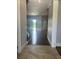 Inviting entryway featuring tile flooring leading to an open living space and backyard views at 6301 Swanson St, Windermere, FL 34786