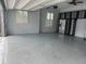 This garage has epoxy flooring, storage racks, and a ceiling fan at 6301 Swanson St, Windermere, FL 34786