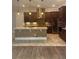 Gourmet kitchen with stainless steel appliances, large island, and custom cabinetry at 6301 Swanson St, Windermere, FL 34786