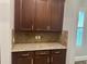 Kitchen counter with cabinetry and granite countertops at 6301 Swanson St, Windermere, FL 34786