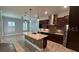 Modern kitchen with granite countertops, stainless steel appliances, and a spacious island at 6301 Swanson St, Windermere, FL 34786