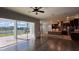 Bright living room with hardwood floors flows to the patio and kitchen at 6301 Swanson St, Windermere, FL 34786