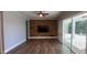 Spacious living room with wood floors and backyard access at 6301 Swanson St, Windermere, FL 34786