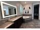 Main bathroom featuring granite countertops, a soaking tub, and an illuminated mirror at 6301 Swanson St, Windermere, FL 34786