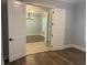 View of a formal office with tile flooring, plantation shutters, and elegant chandelier through french doors at 6301 Swanson St, Windermere, FL 34786