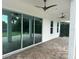 Covered patio with ceiling fans and sliding glass doors, ideal for outdoor living at 6301 Swanson St, Windermere, FL 34786