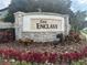 Stone sign for 'The Enclave' community with colorful landscaping at 6301 Swanson St, Windermere, FL 34786