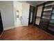 Walk-in closet with hardwood floors and built-in brown cabinets at 6301 Swanson St, Windermere, FL 34786