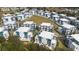 Aerial view of modern, blue and white condos, with green space and common areas at 7740 Sandy Ridge Dr # 206, Kissimmee, FL 34747