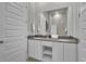 Clean bathroom with a double sink vanity, offering modern fixtures and ample space at 7740 Sandy Ridge Dr # 206, Kissimmee, FL 34747