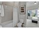 Bright bathroom featuring a bathtub with a shower and a convenient layout, with a bedroom visible at 7740 Sandy Ridge Dr # 206, Kissimmee, FL 34747
