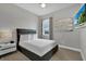 Inviting bedroom with a large window providing natural light and contemporary furnishings at 7740 Sandy Ridge Dr # 206, Kissimmee, FL 34747