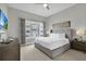 Spacious bedroom featuring a large window offering plenty of natural light and a comfortable modern design at 7740 Sandy Ridge Dr # 206, Kissimmee, FL 34747