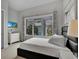Comfortable bedroom with a large window offering a pleasant view and a relaxing space at 7740 Sandy Ridge Dr # 206, Kissimmee, FL 34747