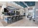 The clubhouse features a long bar with a TV, seating, and a stylish design, perfect for entertaining guests at 7740 Sandy Ridge Dr # 206, Kissimmee, FL 34747