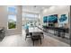Inviting common area with tables, seating, and large windows, offering a bright and social space for residents at 7740 Sandy Ridge Dr # 206, Kissimmee, FL 34747