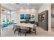 Spacious common area featuring tables, chairs, and large windows, creating an open and inviting community space at 7740 Sandy Ridge Dr # 206, Kissimmee, FL 34747