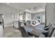 Dining area adjacent to kitchen and living room featuring modern decor at 7740 Sandy Ridge Dr # 206, Kissimmee, FL 34747