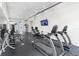 Fitness center featuring two treadmills and ample work out equipment, mirrors, and windows at 7740 Sandy Ridge Dr # 206, Kissimmee, FL 34747