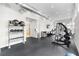 Modern fitness center with top-of-the-line equipment, multiple windows and a mirrored wall to make the room feel more spacious at 7740 Sandy Ridge Dr # 206, Kissimmee, FL 34747