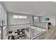 Bright and open living area with high ceilings and a view of the kitchen and dining space below at 7740 Sandy Ridge Dr # 206, Kissimmee, FL 34747