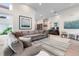 Inviting living room with a large sofa, accent chairs, and stylish decor, offering a comfortable and relaxing space at 7740 Sandy Ridge Dr # 206, Kissimmee, FL 34747