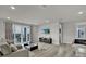 Open living room with a large sliding door leading to a balcony with a view, ample space for entertaining at 7740 Sandy Ridge Dr # 206, Kissimmee, FL 34747