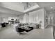 Spacious living room with modern gray sofa and open layout to the kitchen at 7740 Sandy Ridge Dr # 206, Kissimmee, FL 34747
