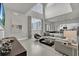 Open-concept living room featuring high ceilings and modern decor at 7740 Sandy Ridge Dr # 206, Kissimmee, FL 34747