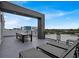 Rooftop patio featuring lounge chairs and a dining table at 7740 Sandy Ridge Dr # 206, Kissimmee, FL 34747