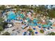 Aerial view of lazy river, water park, palms, umbrellas, beach and cabana at 7740 Sandy Ridge Dr # 206, Kissimmee, FL 34747