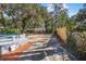 Backyard featuring an in-ground pool, concrete patio space, and wooden fence at 829 Madison Ave, Daytona Beach, FL 32114