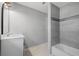 Updated bathroom with tile surround, modern vanity, and a large shower/tub combination at 829 Madison Ave, Daytona Beach, FL 32114