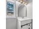 Bright bathroom with updated vanity, large mirror, and natural light from a window at 829 Madison Ave, Daytona Beach, FL 32114