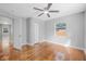 Comfortable bedroom with a ceiling fan, hardwood floors, and a closet for storage at 829 Madison Ave, Daytona Beach, FL 32114