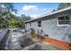 Side exterior view of home featuring a long driveway and landscaped yard at 829 Madison Ave, Daytona Beach, FL 32114