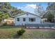 Charming home featuring fresh exterior paint, manicured lawn, and decorative front accents at 829 Madison Ave, Daytona Beach, FL 32114
