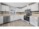 Modern kitchen featuring new stainless steel appliances, bright white cabinets, and stylish countertops at 829 Madison Ave, Daytona Beach, FL 32114